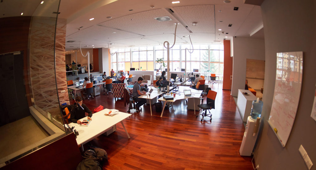 people working in an open office space