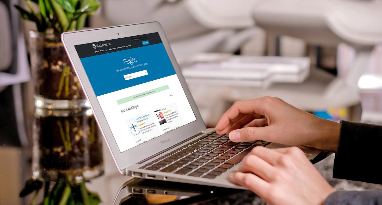The WordPress Plugin directory screen on a laptop