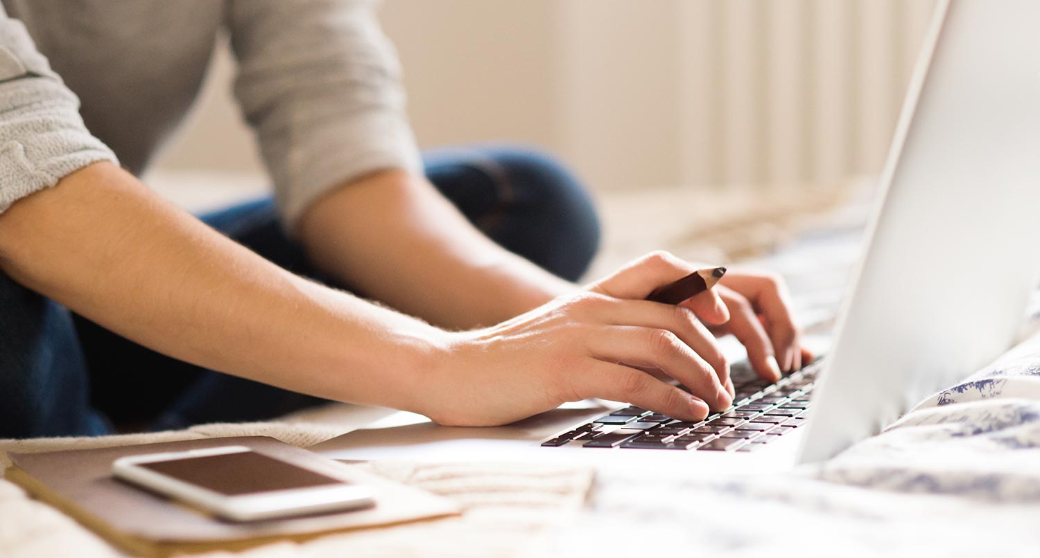 woman working on her laptop with her ecommerce website