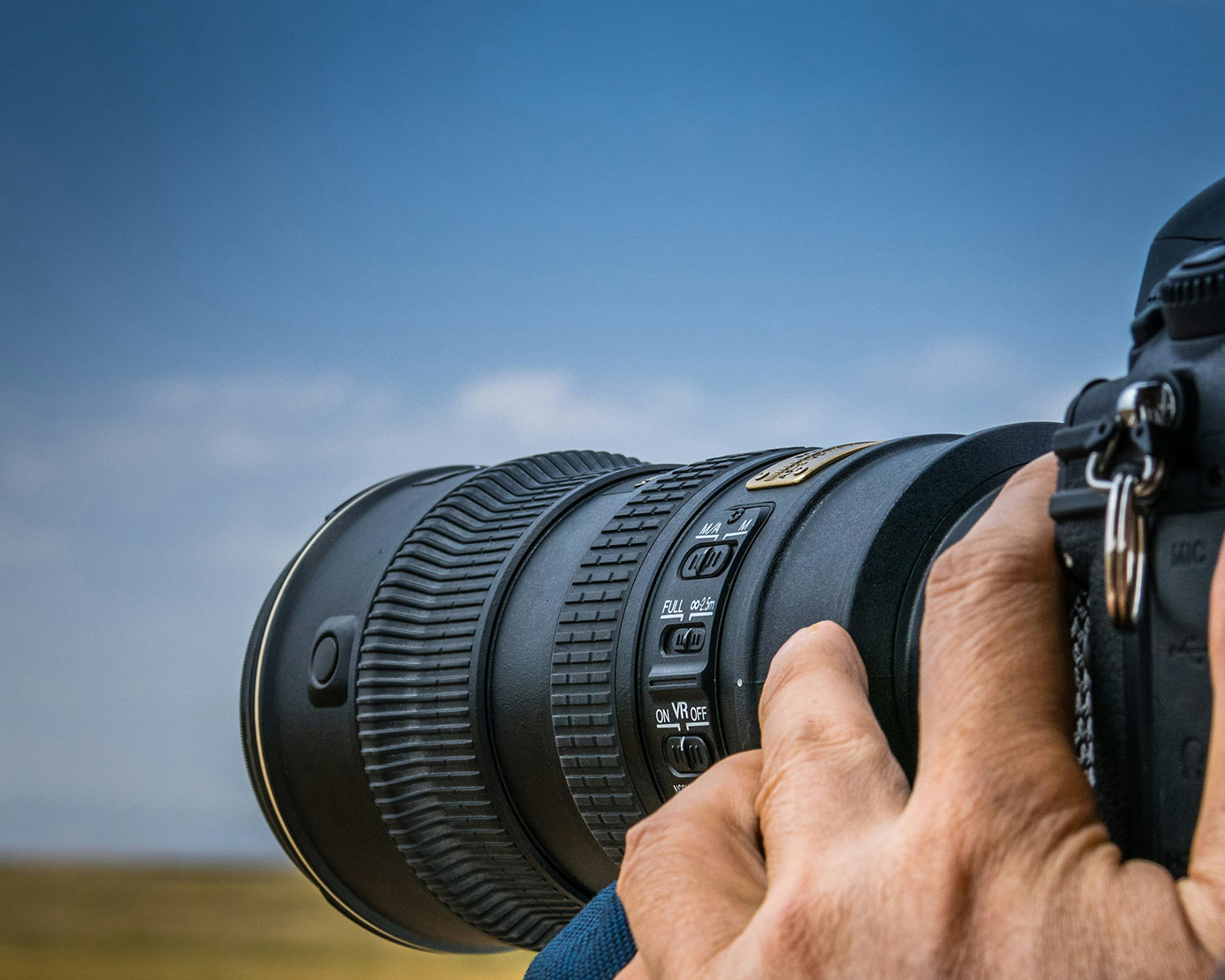 a person holding up a camera to take a picture