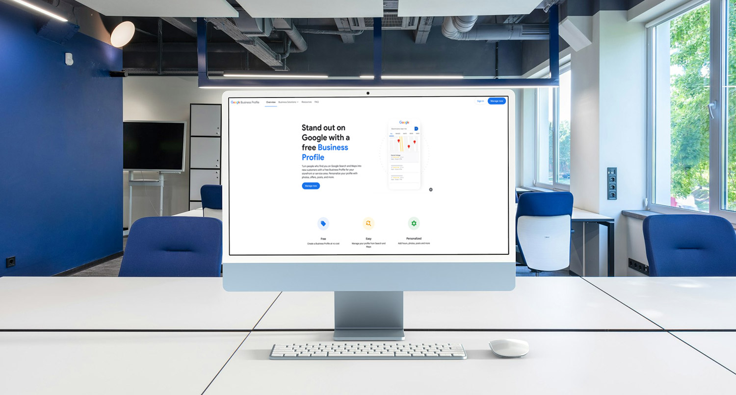 an iMac sitting in a blue room showing thee create a Google Business Profile screen