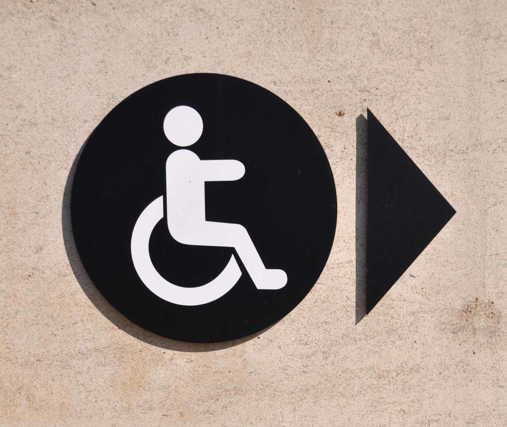 Handicapped sign on a wall
