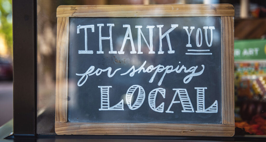 A sign saying "Thank you for shopping local"